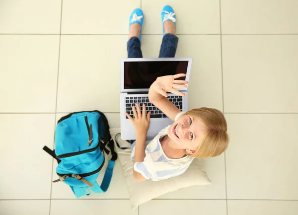 Cute schoolgirl with laptop — Stock Photo, Image