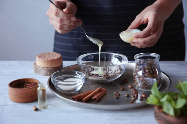 Woman making coffee body scrub