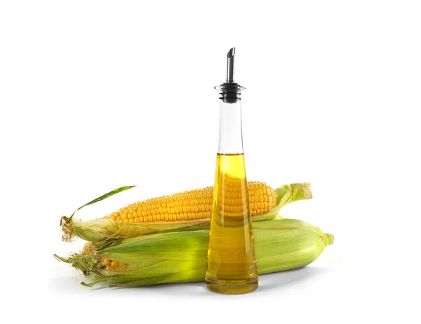 Fresh corn with bottle of oil — Stock Photo, Image