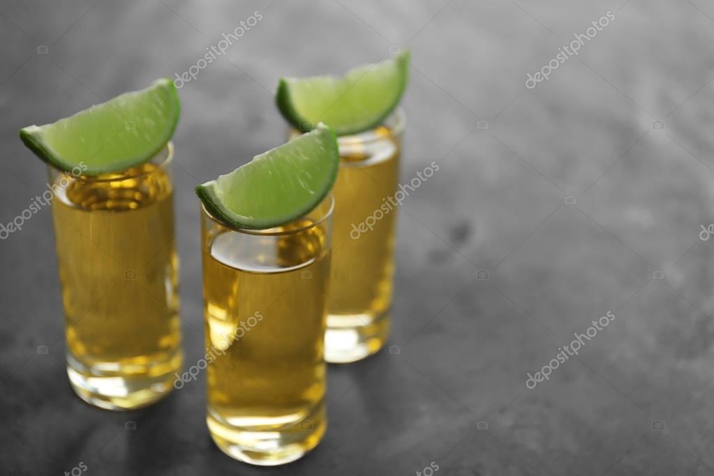 Gold tequila shots — Stock Photo © belchonock 130128426