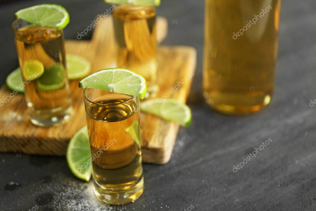 Gold tequila shots Stock Photo by ©belchonock 130128448