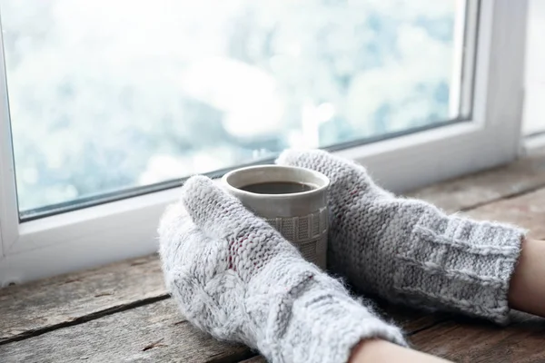 Female hands holding hot drink — Stock Photo, Image