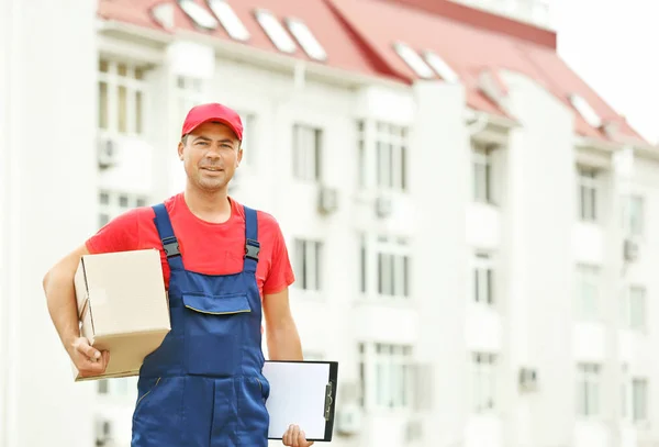 Delivery concept. Postman with box — Stock Photo, Image