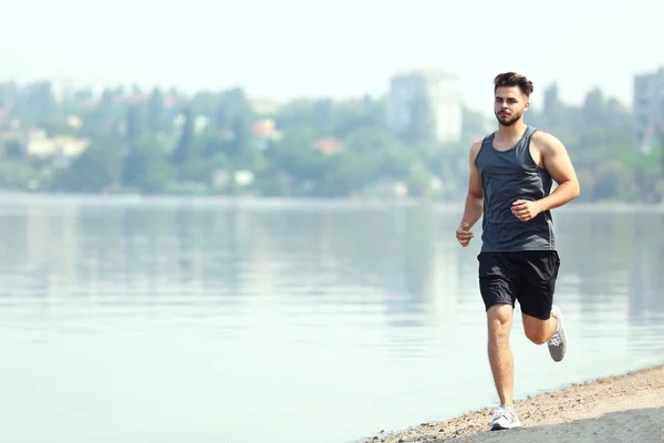 Handsome man jogging — Stock Photo, Image