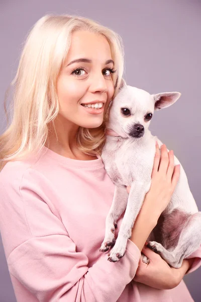 Girl holding cute dog — Stock Photo, Image