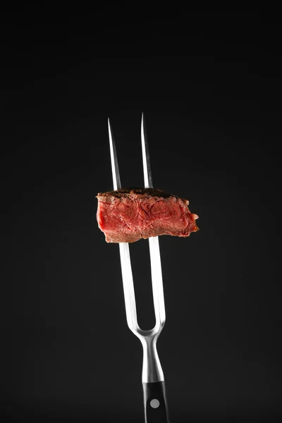 Fork with delicious steak piece — Stock Photo, Image