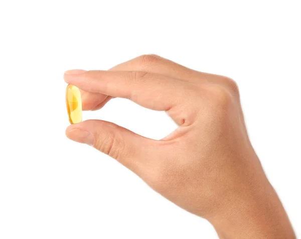 Hand holding omega fish capsule — Stock Photo, Image