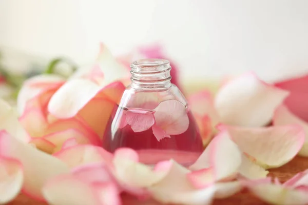 Essential oil with petals — Stock Photo, Image