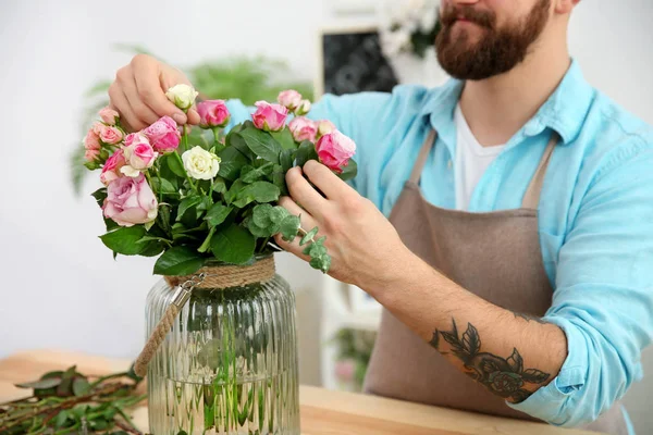 tattooed florist with beautiful flowers