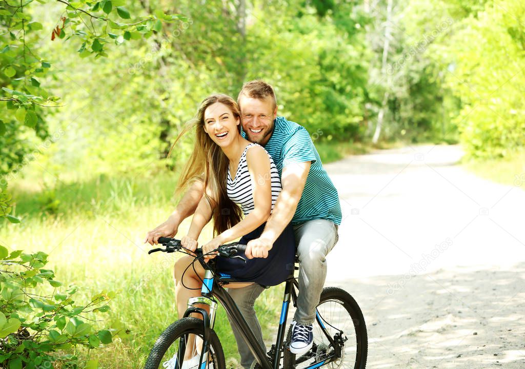 couple riding bicycle