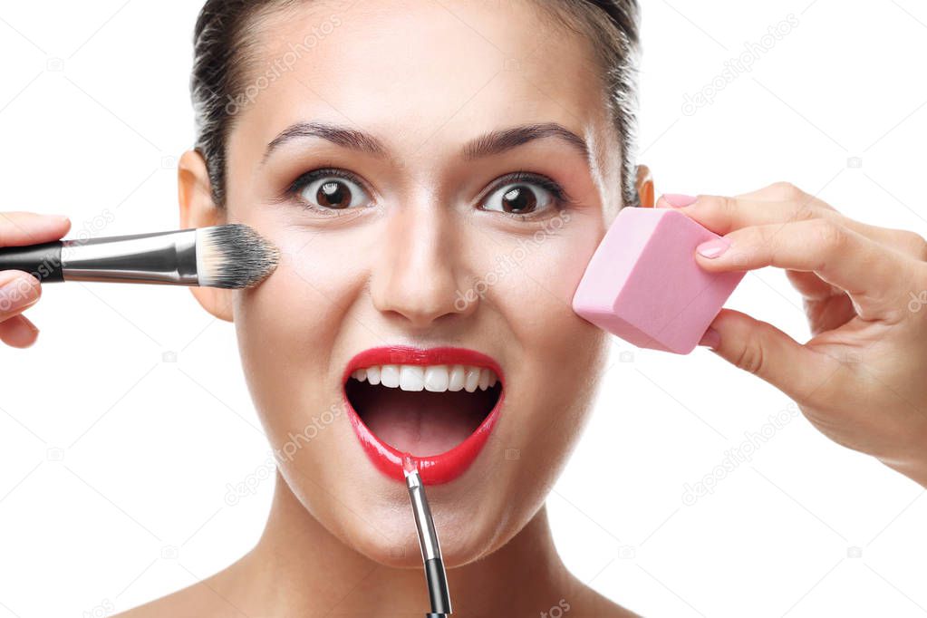 girl applying cosmetics