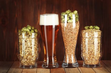 Glasses with beer, hops and malts clipart