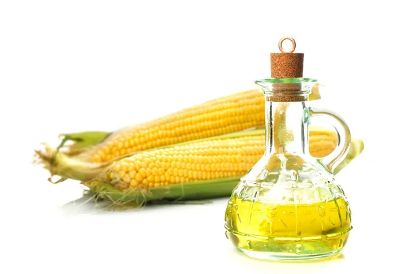 Fresh corn with bottle of oil — Stock Photo, Image