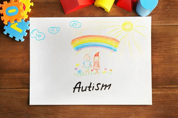 Autyzm słowo napisane na papierze i zabawki — Zdjęcie stockowe