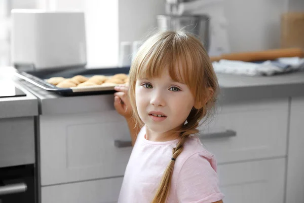 Girl taking biscuits — Stock Photo, Image