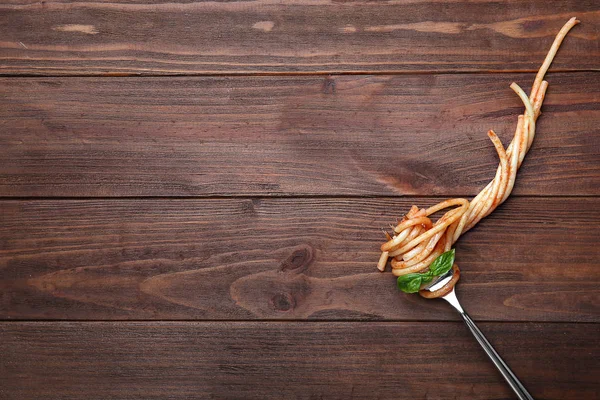 Fork with pasta and basil — Stock Photo, Image