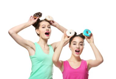 women with tasty donuts