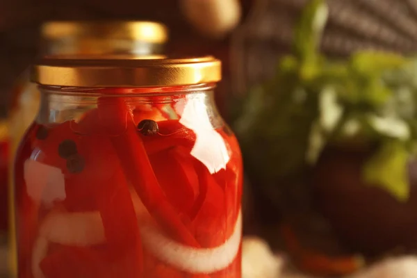 Canned red peppers in jar — Stock Photo, Image