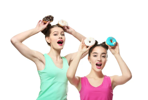 Women with tasty donuts — Stockfoto