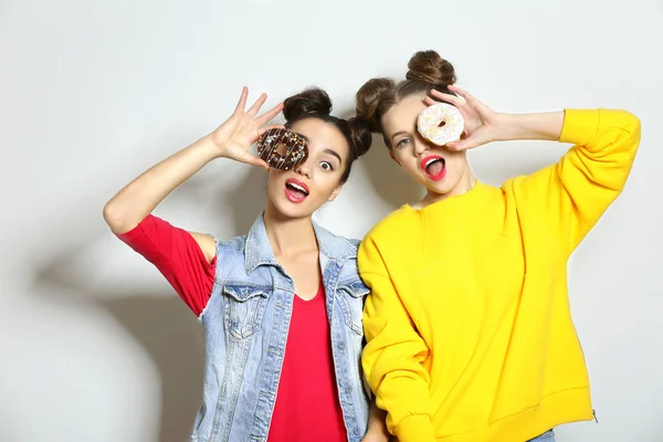 Women with tasty donuts — 스톡 사진