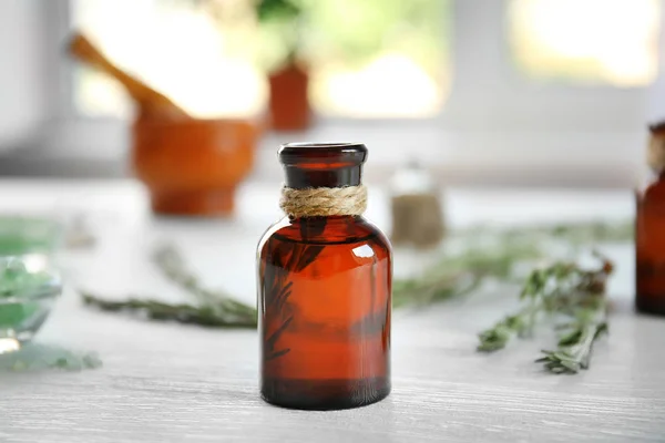 Bottle of rosemary essential oil — Stock Photo, Image