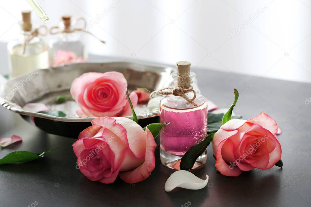 Bottle of aroma oil with roses