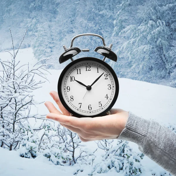 Female hand with alarm clock — Stock Photo, Image