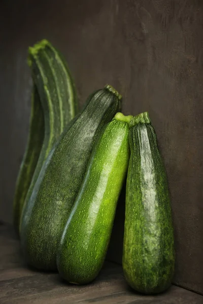 Fresh zucchini on gray background — Stock Photo, Image
