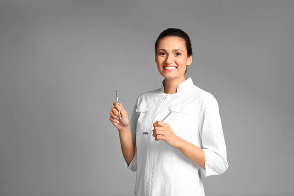 Female dentist with tools 