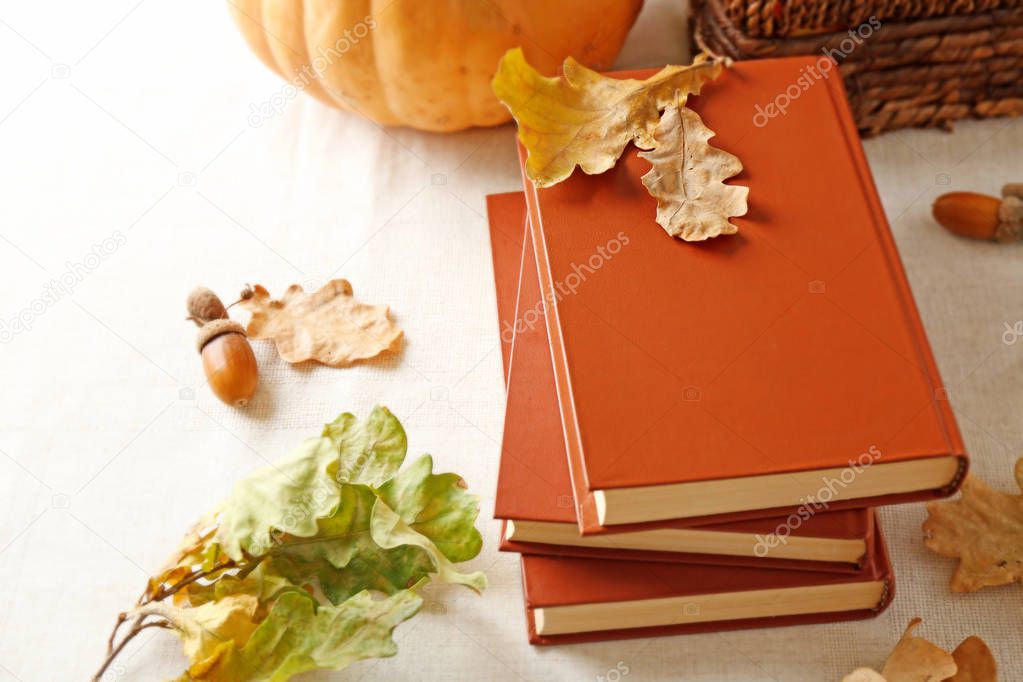 books and autumn leaves 