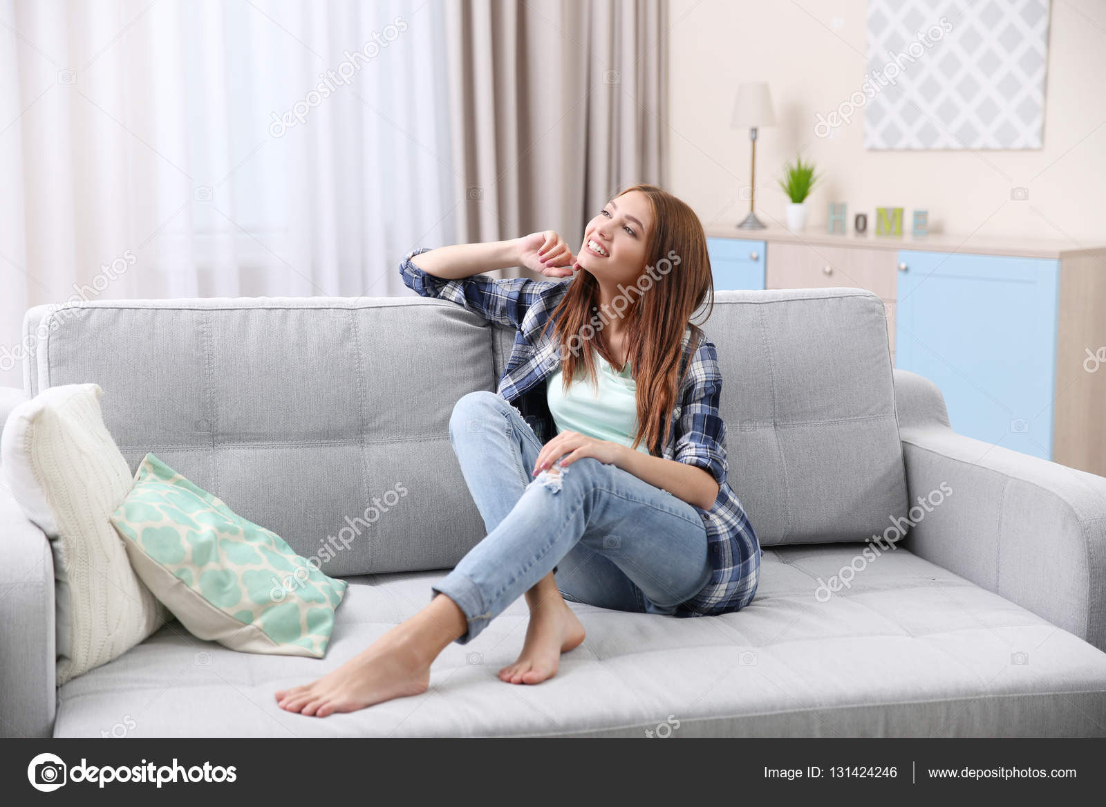 Girl relaxing on couch Stock Photo by belchonock 131424246