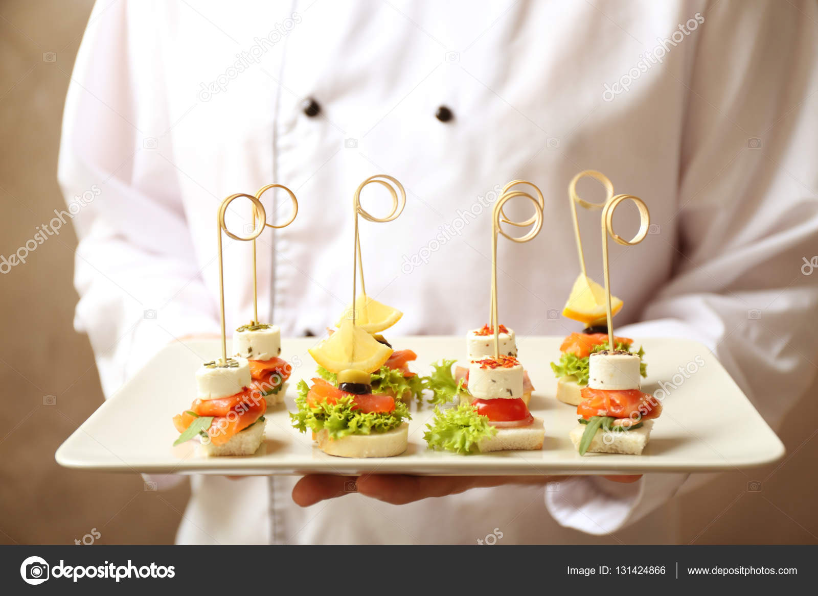 Plate with assorted canapes — Stock Photo © belchonock 131424866