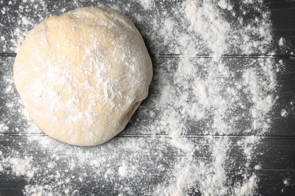 Raw dough for pizza with flour — Stock Photo, Image