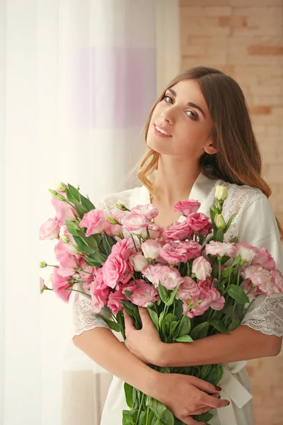 Pretty girl holding big bouquet — Stock Photo, Image