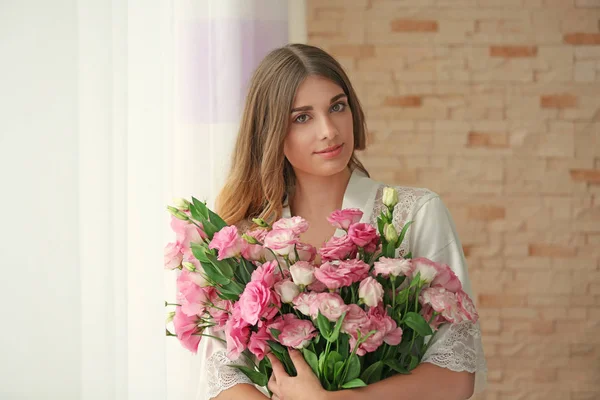 Pretty girl holding big bouquet