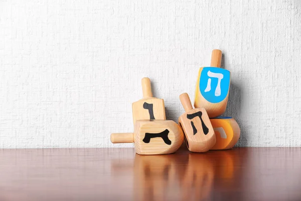 Dreidels for Hanukkah on table — Stock Photo, Image