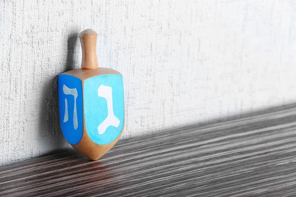 Dreidel for Hanukkah on table — Stock Photo, Image