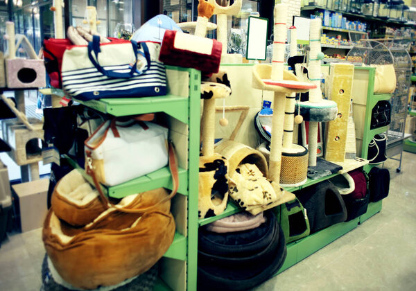 Different animal goods on pet shop shelves