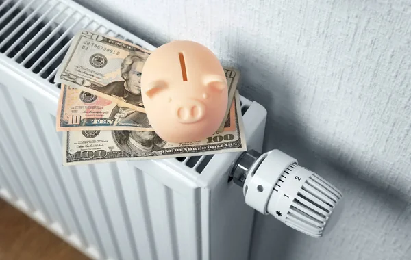 Heating battery with piggy bank on it — Stock Photo, Image