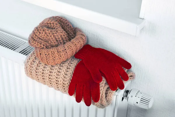 Heating radiator with warm clothes indoor — Stock Photo, Image