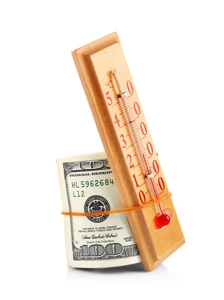 Termómetro e dinheiro sobre fundo branco — Fotografia de Stock
