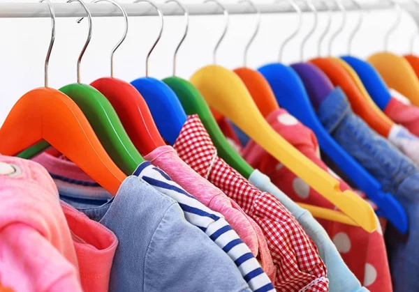 Clothes hanging on rack — Stock Photo, Image