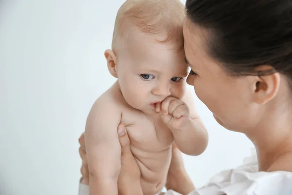 Mother holding little baby indoors — Stock Photo, Image