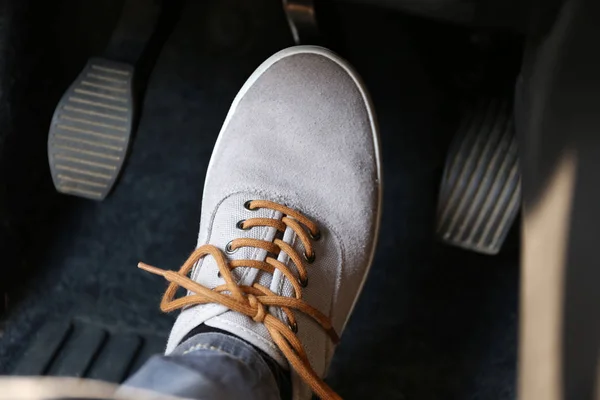 Human foot pressing car pedal — Stock Photo, Image