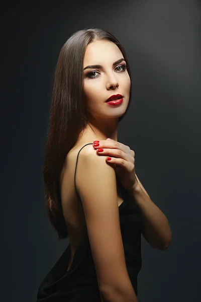 Portrait of beautiful young woman model with bright makeup on dark background — Stock Photo, Image