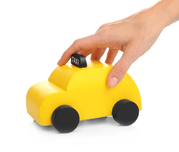 Hand spelen met speelgoed taxi cabine — Stockfoto