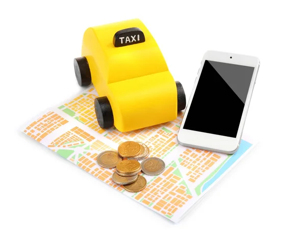 Sarı oyuncak taksi ve smartphone — Stok fotoğraf