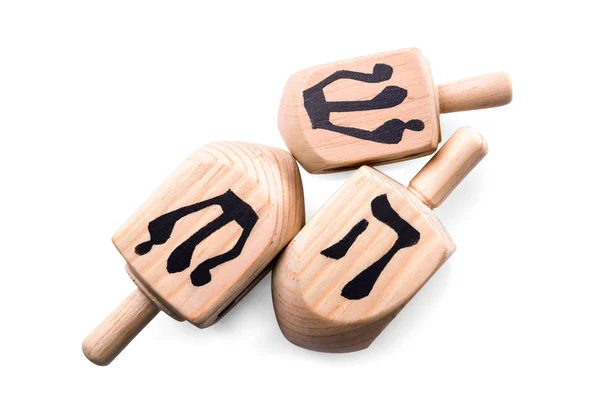 Dreidels de madeira para Hanukkah no fundo branco — Fotografia de Stock