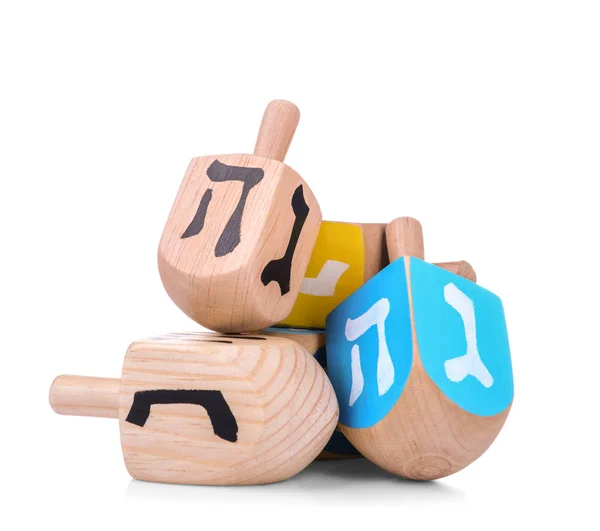 Dreidels de madeira para Hanukkah no fundo branco — Fotografia de Stock