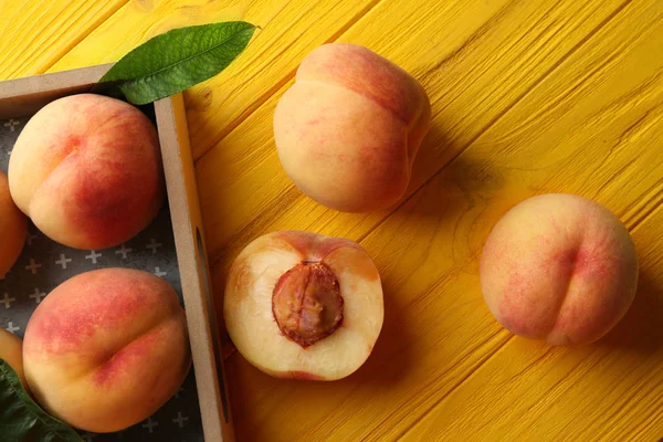 Fresh juicy peaches in tray